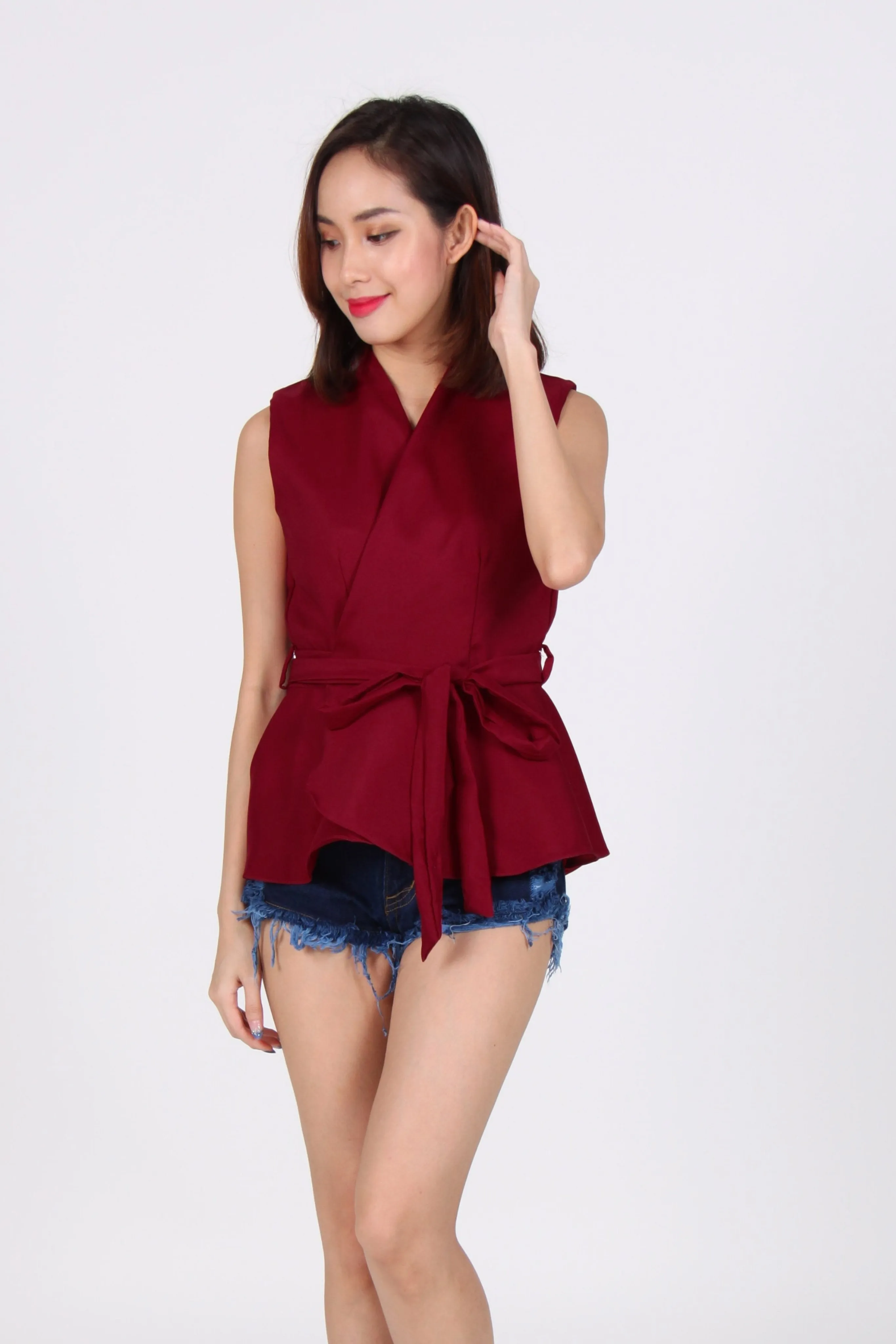 Wrap Peplum Top In Maroon