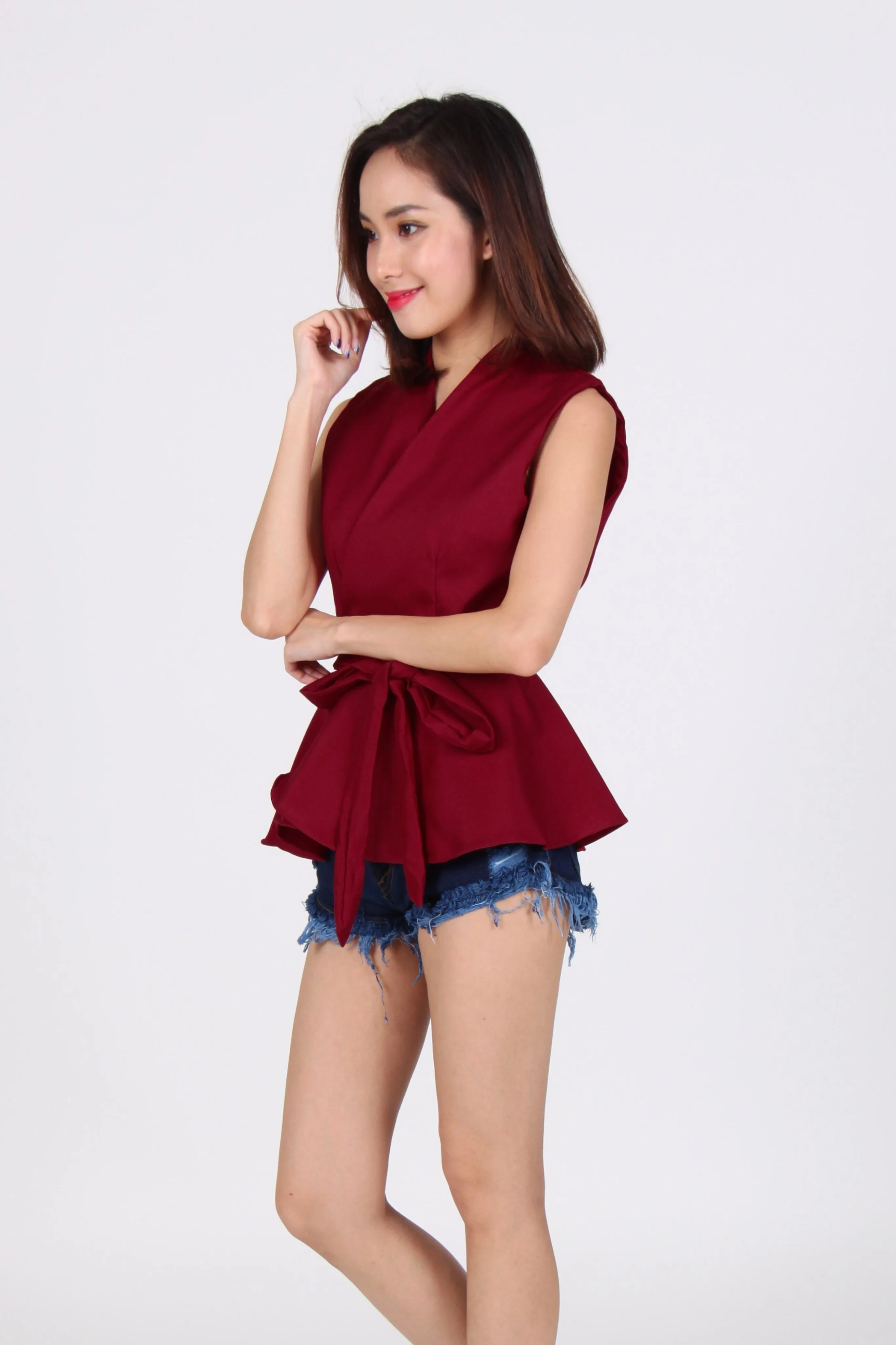 Wrap Peplum Top In Maroon